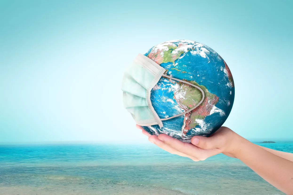 World Oceans Day conceptCorona virus or COVID-19 Earth wearing a mask, this image furnished by NASA