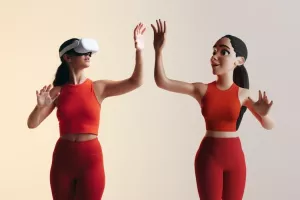 Getting into the metaverse. Sporty young woman playing virtual reality games as a 3D avatar. Young woman interacting with immersive technology using a virtual reality headset.<br>avatar, avatari, avatarka, avatarke. videoigre video igre videoigra video igra, gaming, gamerice