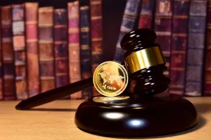 Judge hammer and XRP crypto coin. Justice courtroom. Ripple demands Bitcoin and Ethereum docs from SEC amid legal fight. Delist &Ntilde;�ryptocurrency trading. Exchanges and traders. law to ban blockchain<br>ripple SEC