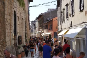 Poreč, Croatia - 07 27 2023Lively image of the bustling city center of Poreč, Croatia, filled with a vibrant crowd of people.