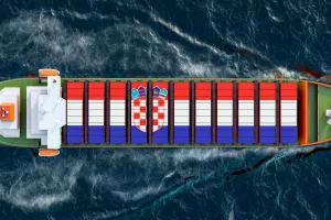 Freighter ship with Croatian cargo containers sailing in ocean, 3D rendering