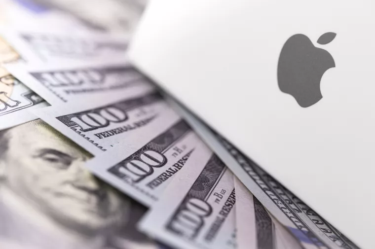 Apple logo on box, dollars. Apple is a multinational technology company that designs, develops, sells electronics, computer software, online services. Ekaterinburg, Russia - February 28, 2018