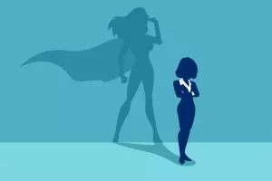 Vector of a strong business woman with a shadow imagining to be a super hero looking aspired.<br>žena, samopouzdanje, samopo&scaron;tovanje, žene u biznisu