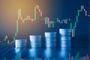 Stack of money coin with trading graph, financial investment concept with blue filter can be use as background<br>dionički kapital, dokapitalizacija, burza, cijene na burzi, cijene dionica, cijena dionica