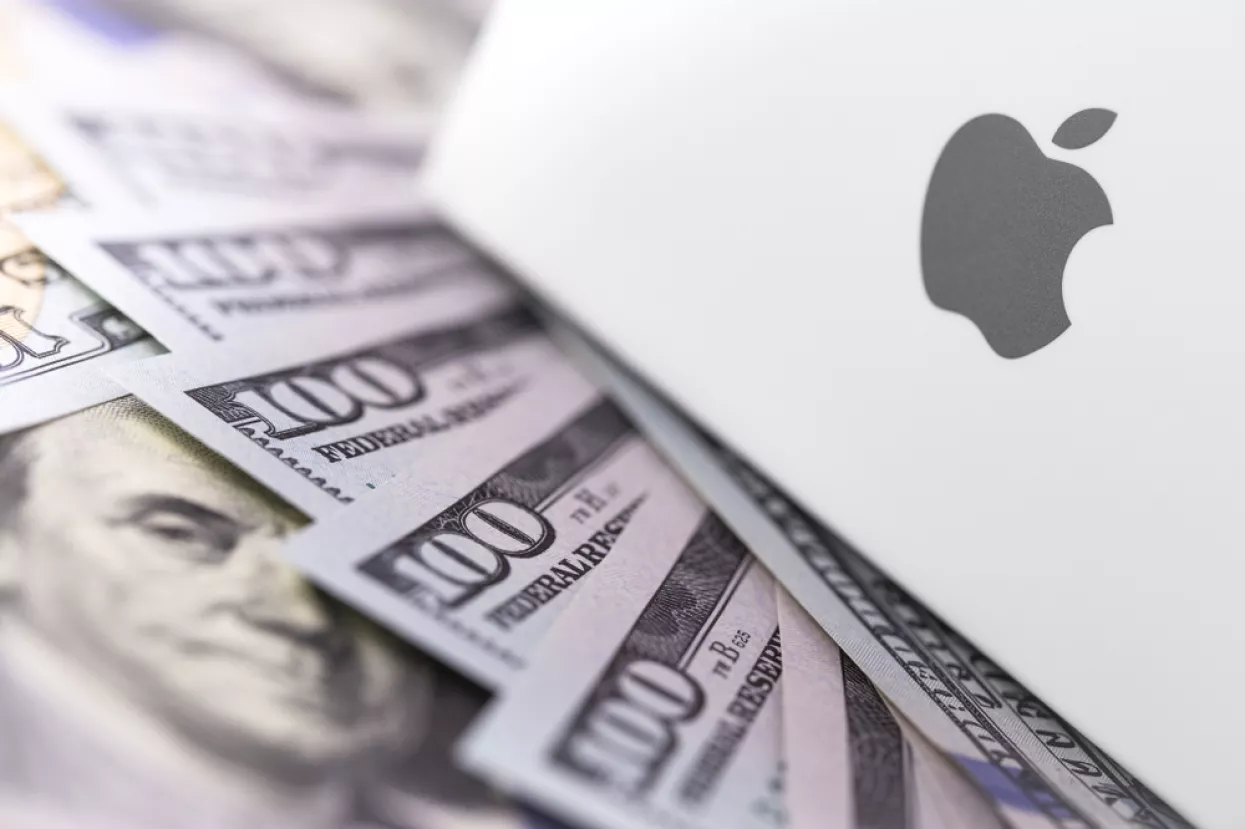 Apple logo on box, dollars. Apple is a multinational technology company that designs, develops, sells electronics, computer software, online services. Ekaterinburg, Russia - February 28, 2018