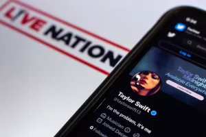 Vancouver, CANADA - Dec 3 2022 Twitter account of popular US singer-songwriter Taylor Swift in Twitter website seen in iPhone on Live Nation logo background. Selective focus, Ticketmaster