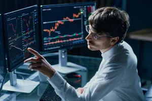 financial analyst working on modern computers. close-up.