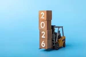 2026 happy new year background. new year industrial concept forklift carrying box written 2026