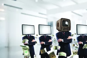 Businessmen in suits with old TV instead of their heads keeping arms crossed while standing in a row and one at the head with TV inside office building.